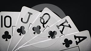 Royal Flush on a black background, a very rare poker hand