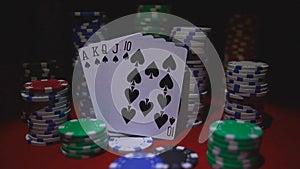 Royal flush on cards and poker chips