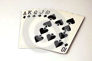 Royal flush cards poker hand with the spades suit