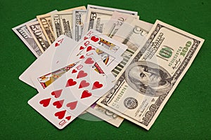 Royal Flush Hearts And Dollar Money On Green Felt