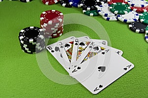 Royal flush in poker cards, chips table