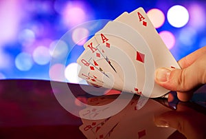Royal flush poker cards combination on blurred background casino luck fortune
