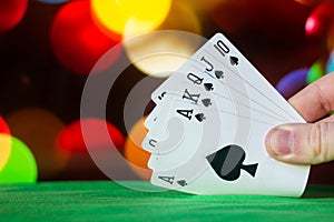 Royal flush poker cards combination on blurred background casino luck fortune card game