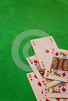 Royal flush poker cards combination on green background casino game fortune luck