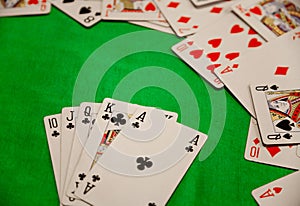 Royal flush poker cards combination on green background casino game fortune luck