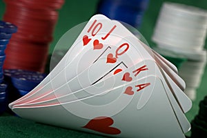 Royal flush of spades and chips