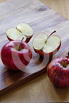 Royal Gala apples on wooden background with copyspace