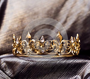 Royal gold crown with fleur de lys elements. Luxury