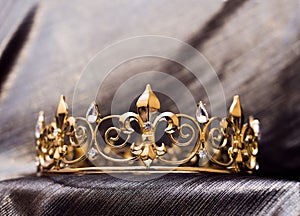 Royal gold crown with fleur de lys elements. Luxury