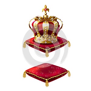 Royal golden crown on red velvet pillow