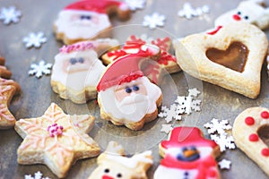 Royal icing decorated christmas cookies on wooden background