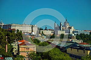 Royal Palace and Almudena Cathedral with buildings among trees in Madrid