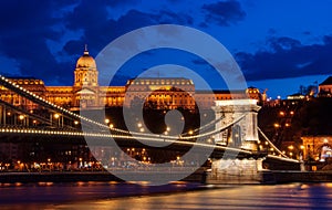 Royal Palace or the Buda Castle and the Chain Bridge after sunset in Budapest in Hungary