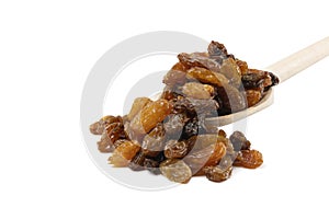 Royal raisins on wooden spoon isolated on white background. Spice and food ingredients