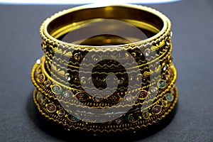 Royal  vintage artifact goldcolour  jewellery design on black shadow background.