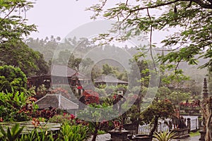 Royal Water Palace of Tirta Gangga in winter rainy season. Landmark in Bali, Indonesia