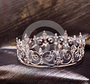 Royal white gold crown with fleur de lys elements. Luxury