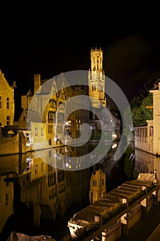 Rozenhoedkaai canal and Belfort Tower in Bruges photo