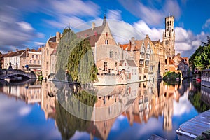 Rozenhoedkaai canal reflection at sunrise and blurred clouds, Bruges