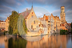 Rozenhoedkaai canal reflection at sunrise and blurred clouds, Bruges