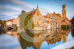 Rozenhoedkaai canal reflection at sunrise and blurred clouds, Bruges