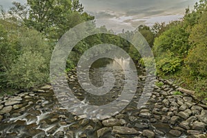 Roznovska Becva river in Valasske Mezirici in autumn cloudy evening