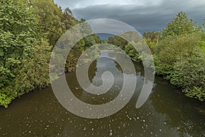 Roznovska Becva river in Valasske Mezirici in autumn cloudy evening