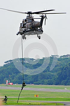 RSAF Guards repelling from Super Puma helicopter