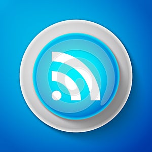 RSS icon isolated on blue background. Radio signal. RSS feed symbol. Circle blue button