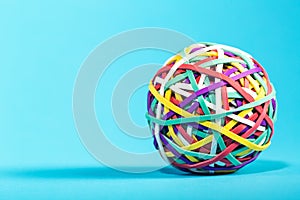 Rubber band ball on blue background