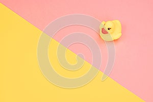 Rubber bath duck on colorful background. Top view on toy rubber duck. Toy play for kid ducky floating.
