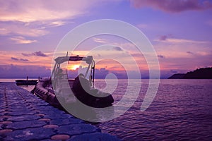 Rubber boat or dinghy dock on the floating pier early morning beautiful sunrise