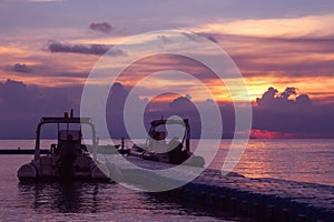 Rubber boat or dinghy dock on the floating pier early morning beautiful sunrise