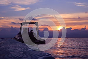Rubber boat or dinghy dock on the floating pier early morning beautiful sunrise