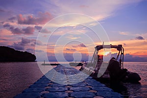 Rubber boat or dinghy dock on the floating pier early morning beautiful sunrise