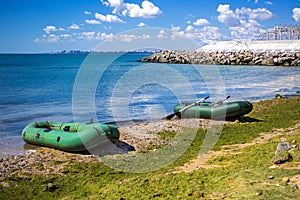 Rubber boat on the sea shore. Rubber inflatable boat for fishing