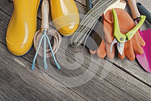 Rubber boots and garden tools.