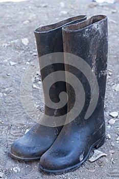 Rubber boots. Old shoes. Dirty shoes. Worn out