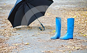 Rubber boots and umbrella