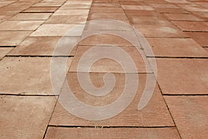 Rubber cluster floor. red square covering the ground close up. structure background