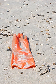 Rubber glove on the beach