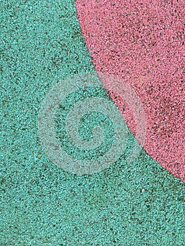 Rubber play ground floor surface covering texture background turquoise and pink