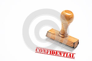 Rubber stamp with confidential  sign on white background
