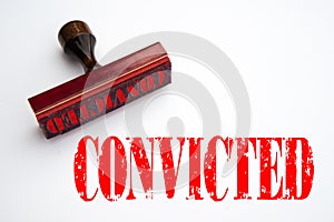 Rubber stamp with the word CONVICTED photo