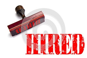 Rubber stamp with the word HIRED