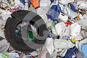 Rubber tire and plastic garbage in a landfill - a problem of environmental pollution