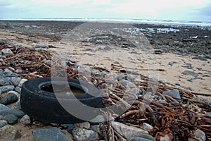 Rubber tyre polluting beach