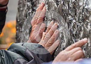 Rubbing side of statue brings good luck in Tianjin