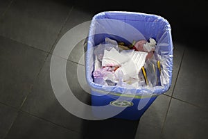 Rubbish bin full of trash with copy space for your text