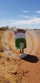 Rubbish bin trash waste recycle outdoors out side in outback Australia environment